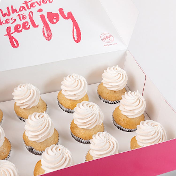12 pink champagne cupcakes in a pink branded box