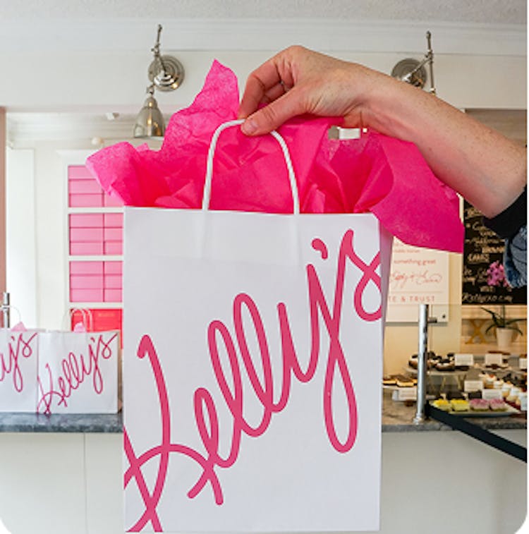 Pink and white Kelly's Bake Shoppe bag with pink tissue
