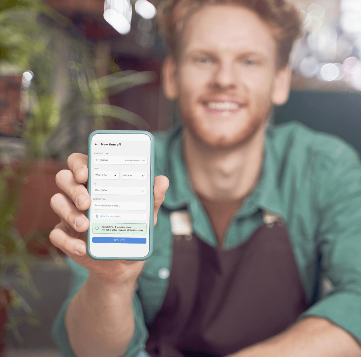 A young gardener shows us his smartphone, on which Kenjo's absence management can be seen