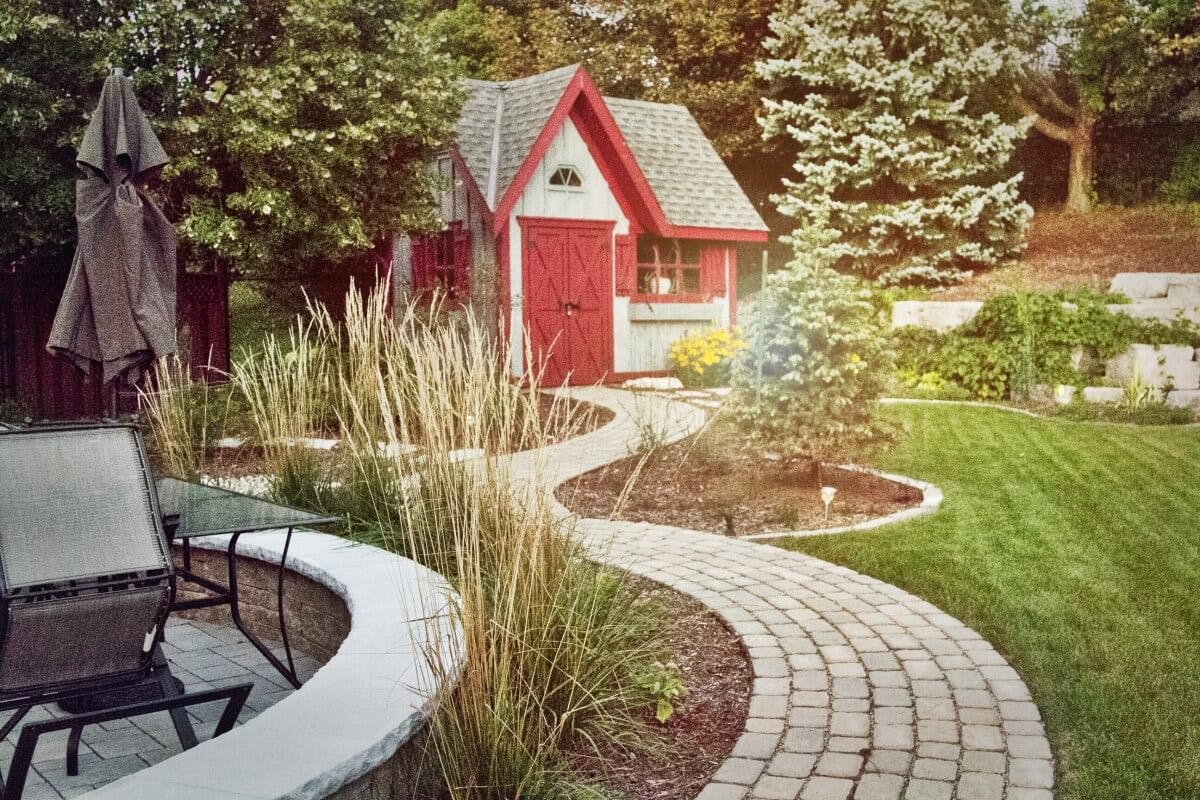 Stone walkway leading up to a red shed