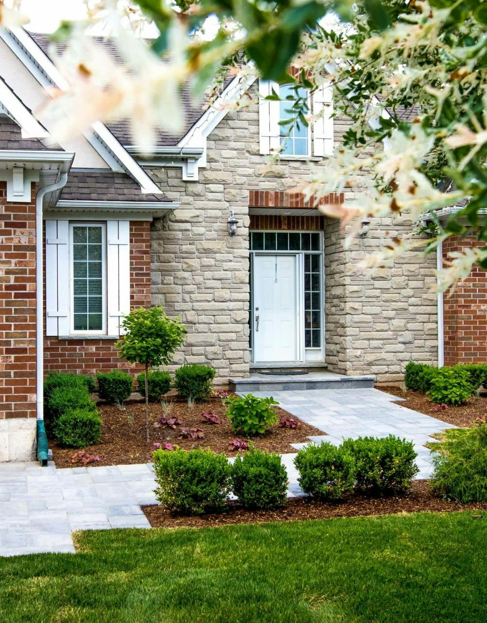 Front of a house with a stone walkway