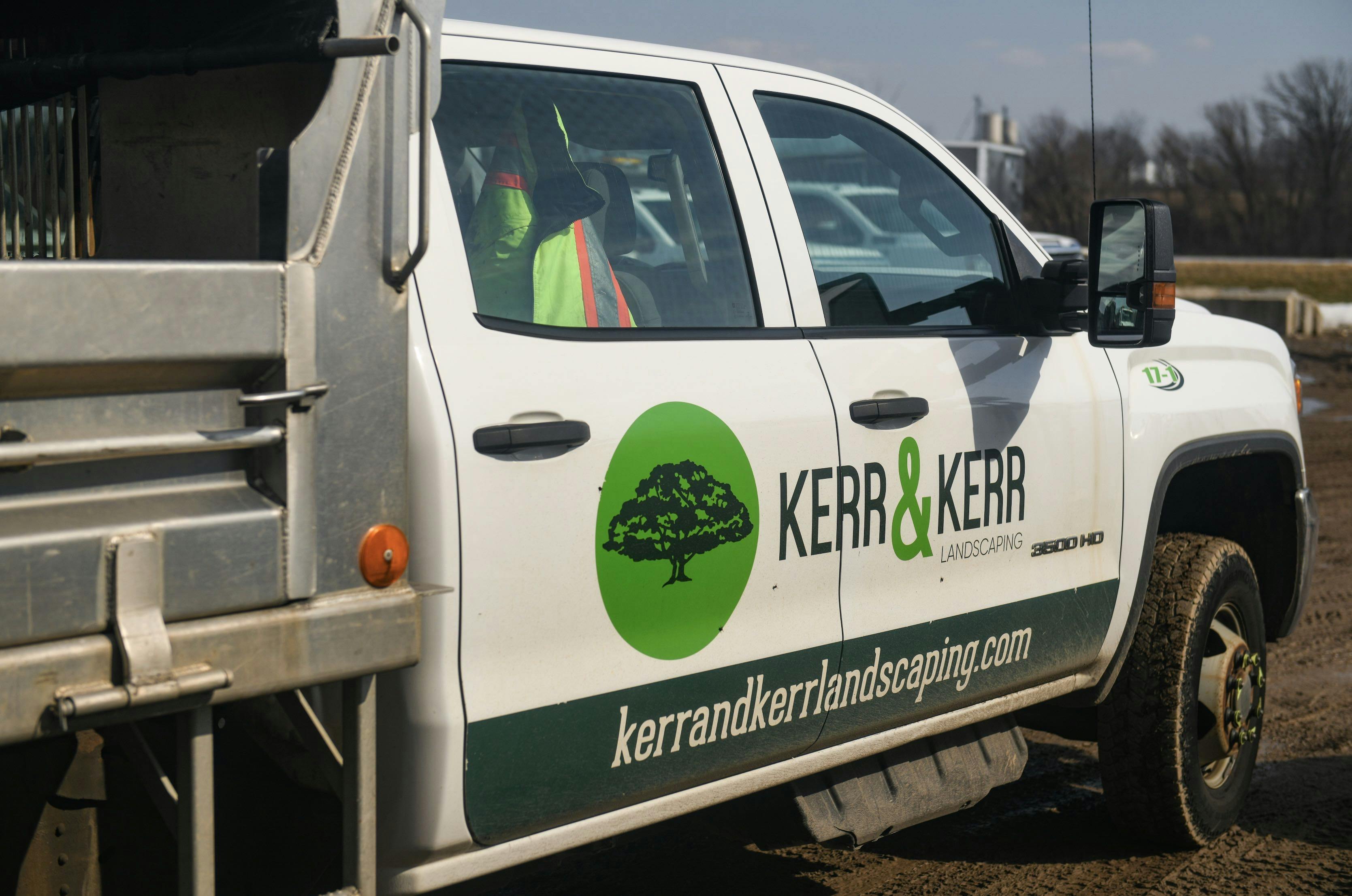 View of the side cab of a Kerr and Kerr landscaping truck.