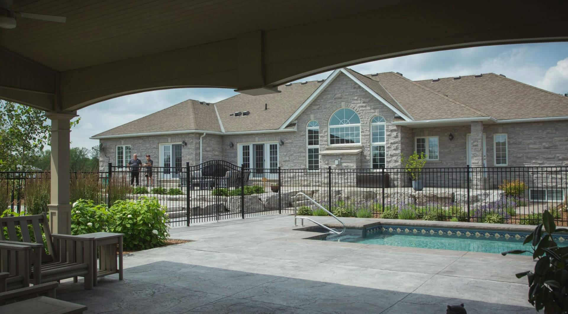 Covered patio by a pool