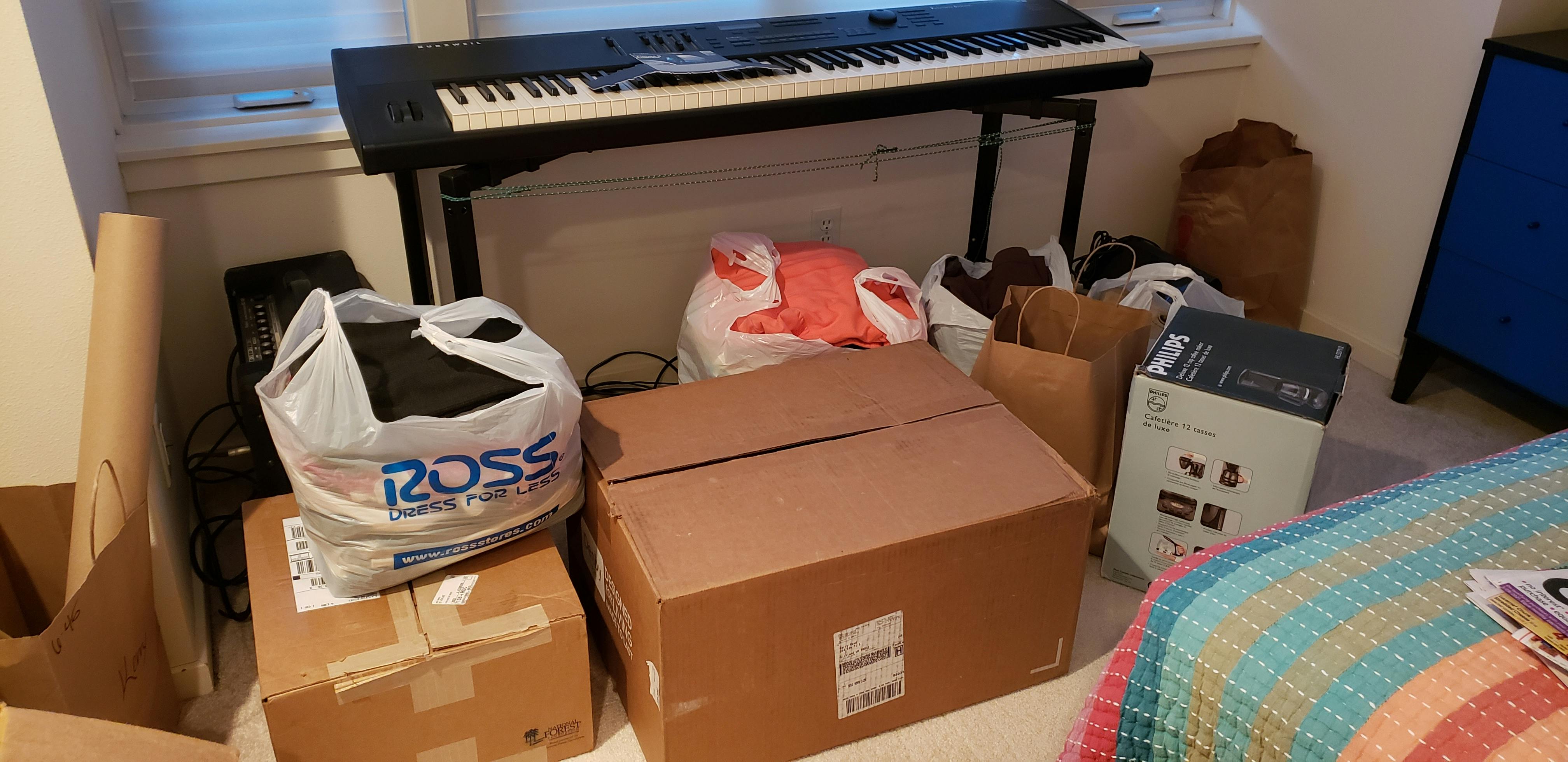 A bunch of boxes and bags full of extra stuff