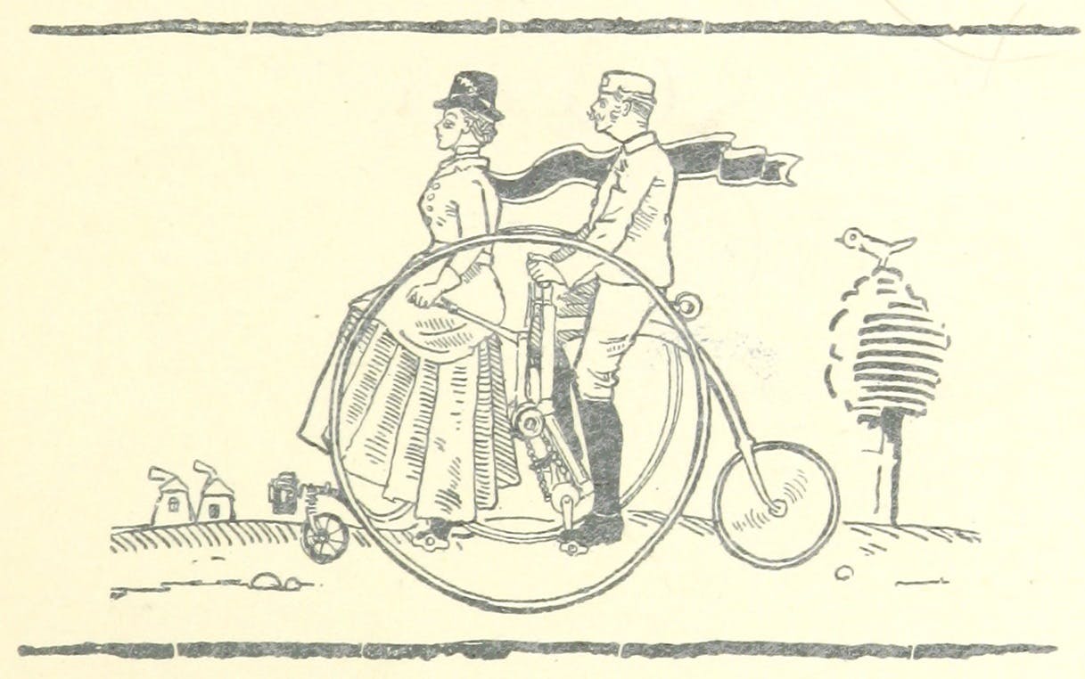 A man and woman on a bicycle.