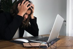 Woman at computer stressed