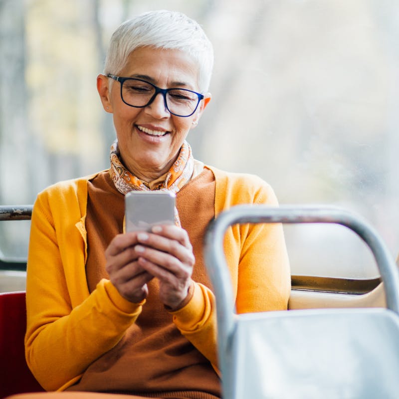 Lady on bus on phone