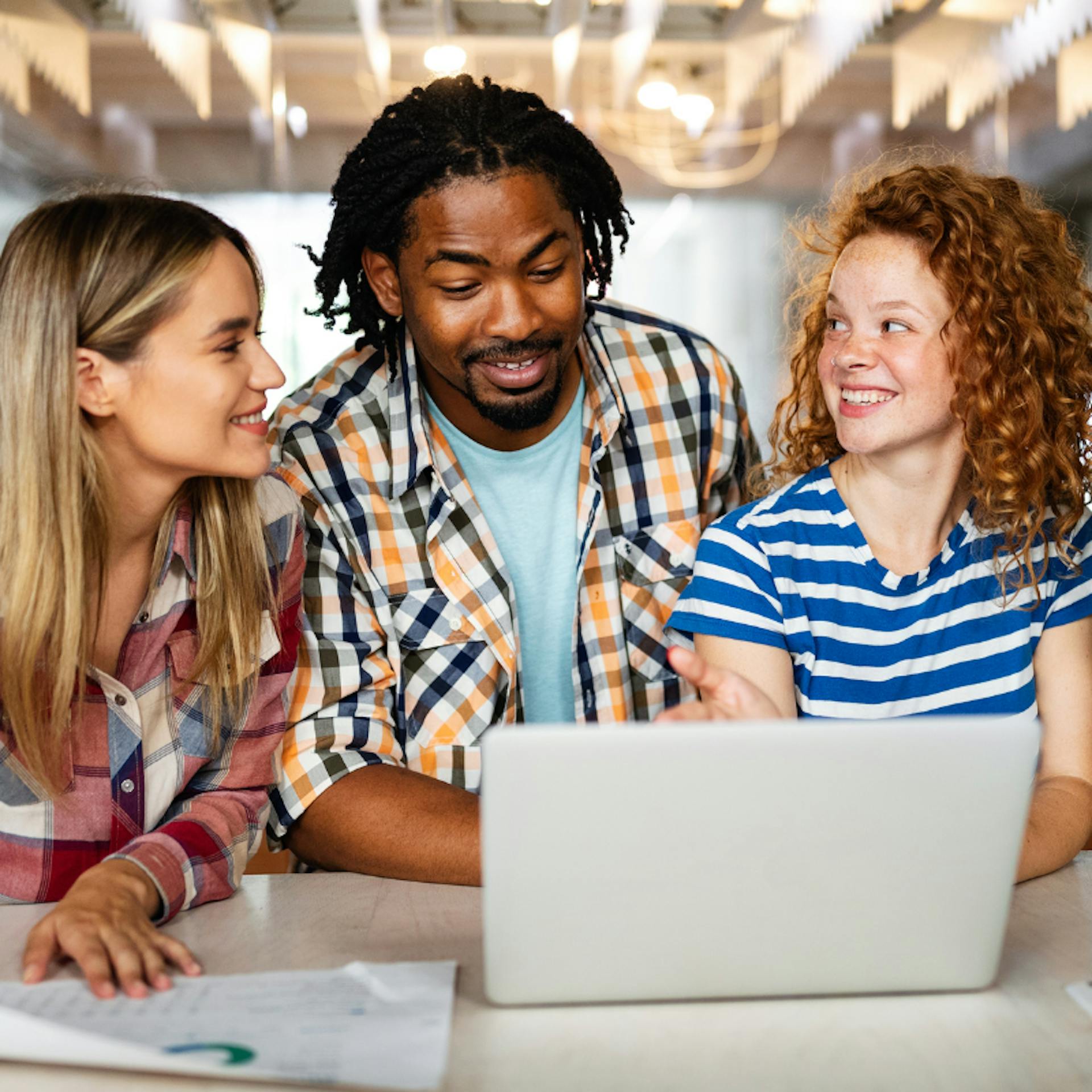 Young team looking at laptop