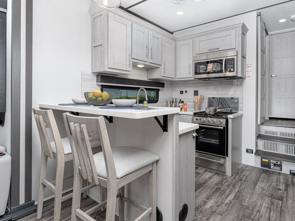 Fuzion 421 Kitchen, featuring two bar stools and plenty of counterspace