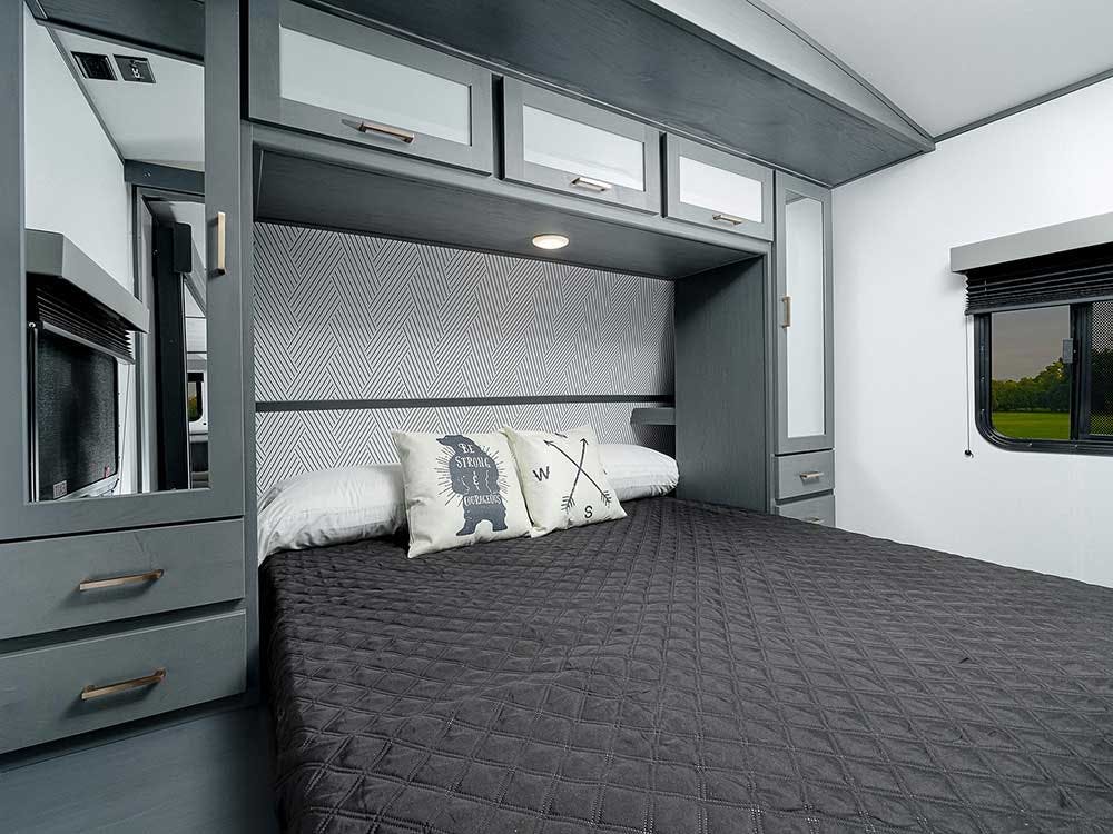 Bullet 287QBS Bedroom, featuring queen sized bed and plenty of cabinetry