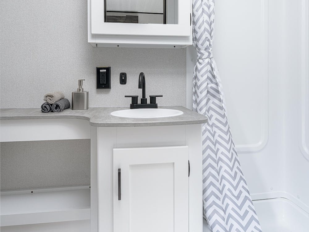 Hideout 22MLS Bathroom, vanity and shower showing 