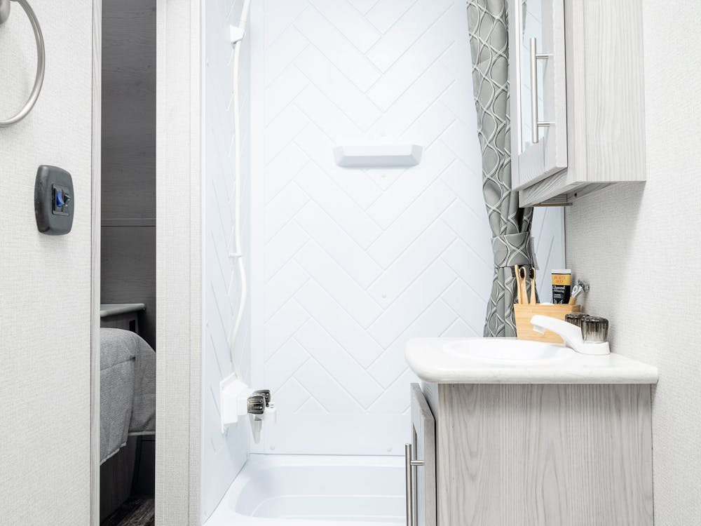Impact 29V bathroom, vanity and shower shown in photo