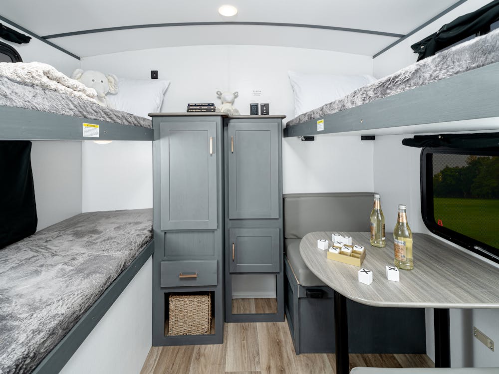 Bullet 287QBS bunkroom featuring 3 bunks & junior dinette that can convert into 4th bunk