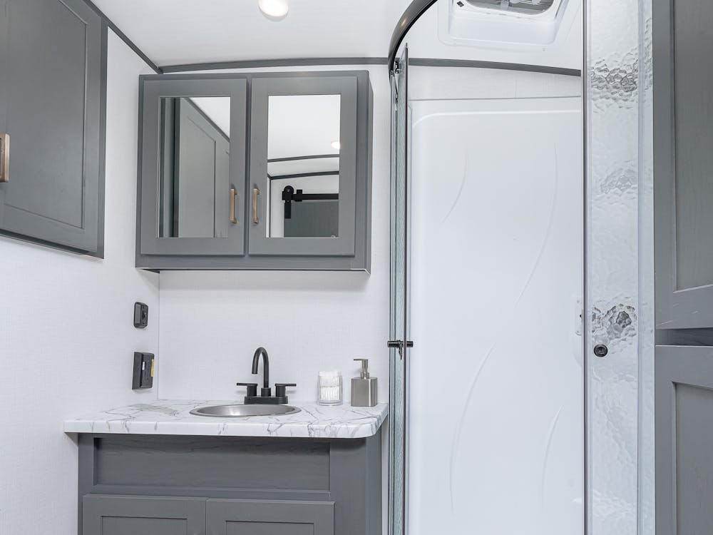 Bullet 260RBS Bathroom, featured glass shower surround and vanity.