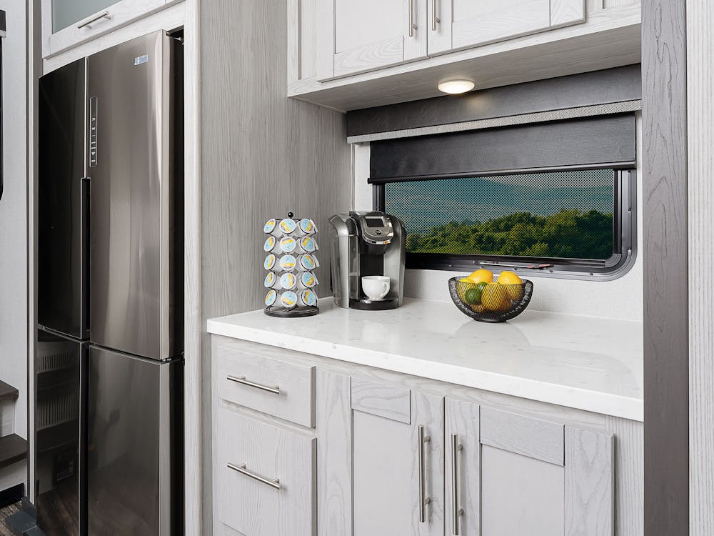 Fuzion 421 Kitchen prep space and refrigerator shown in photo