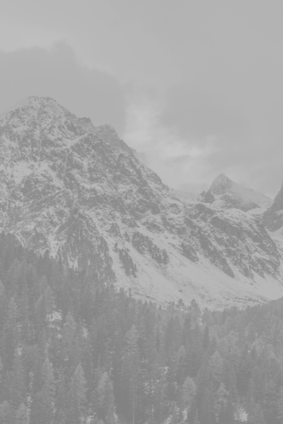 Background image of snow covered mountains.