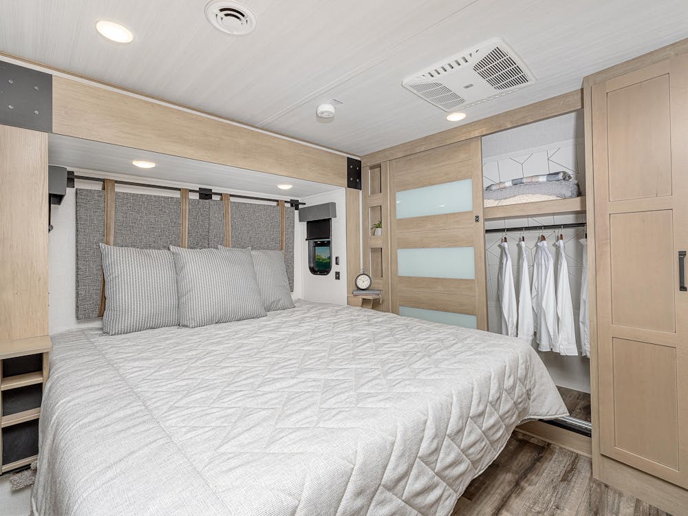 Raptor 424 bedroom, showing off bed and closet storage