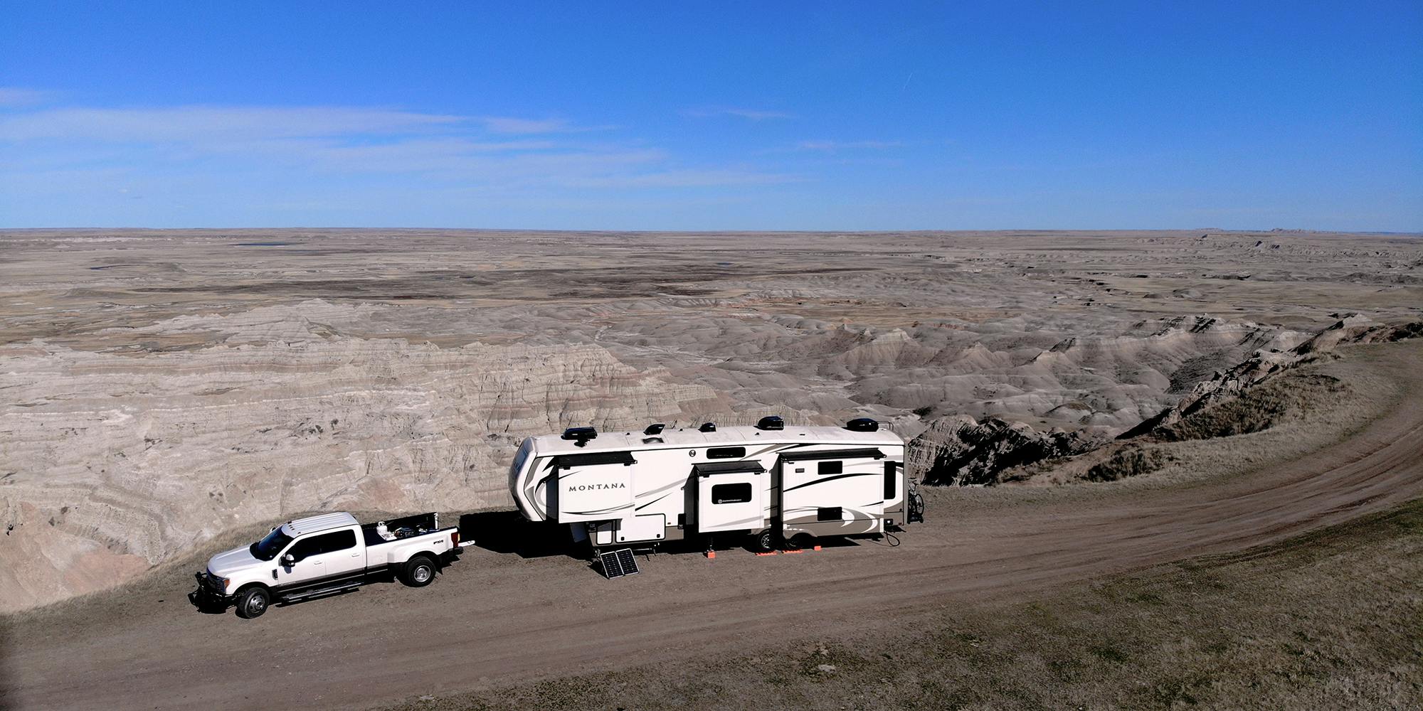 A fifth wheel parked in the Badlands National Park. 