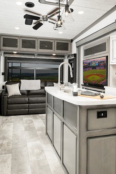 Interior shot of an RV kitchen and living area. 