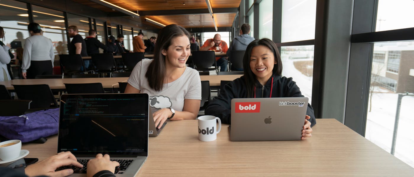 Kickbooster staff working together in the office in Winnipeg, Canada.