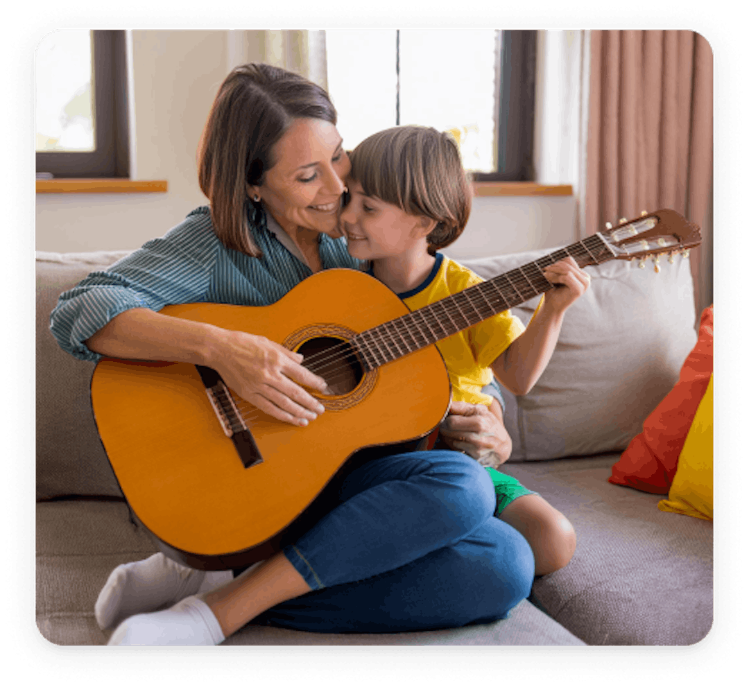 Parent play guitar together 