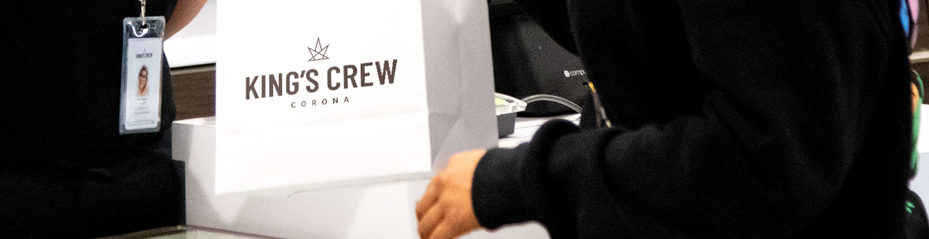 Crew Member handing over a bag to a customer