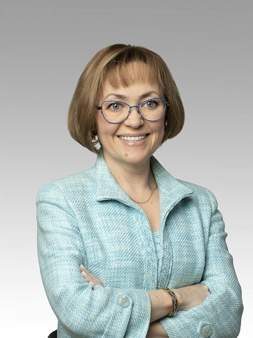 Svetlana Polikarpova headshot on a gray gradient backdrop