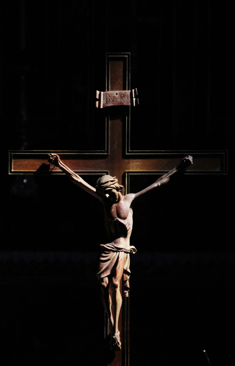 Free Good Friday photo Jesus on a cross in soft lighting - Kittl