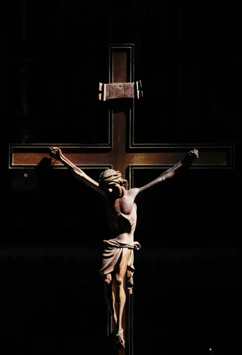 Free Good Friday photo Jesus on a cross in soft lighting - Kittl