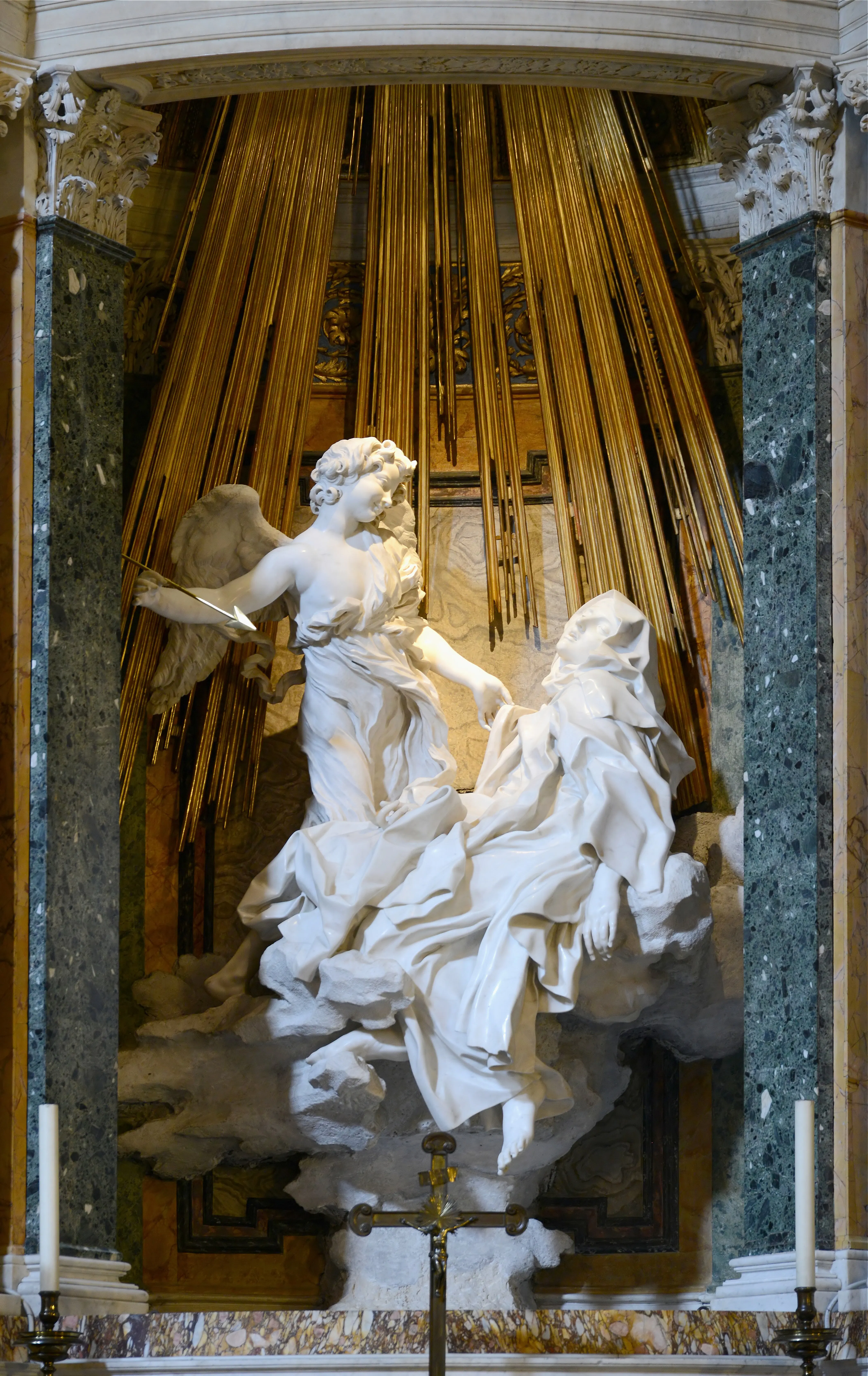 Baroque art example in sculpture: Ecstasy of Saint Teresa" by Gian Lorenzo Bernini, 1647–52. Photo by Livioandronico2013, licensed under CC BY-SA 4.0, via Wikimedia Commons.