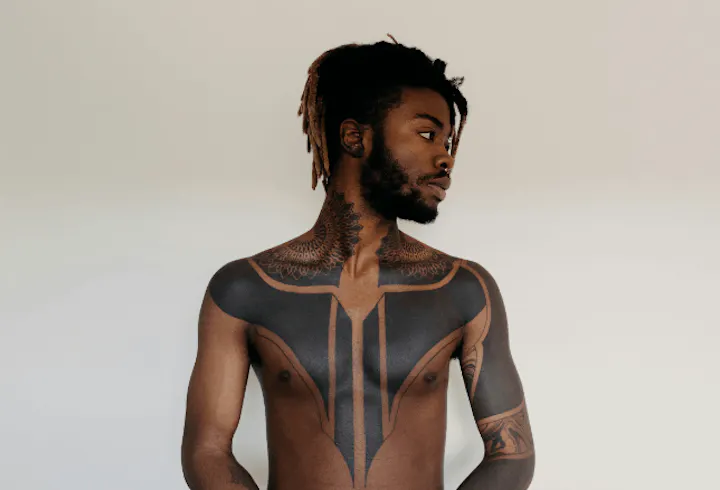 Blackwork tattoo style on man's chest