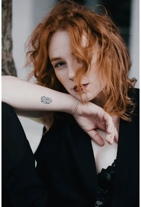 A woman with a minimalist style tattoo