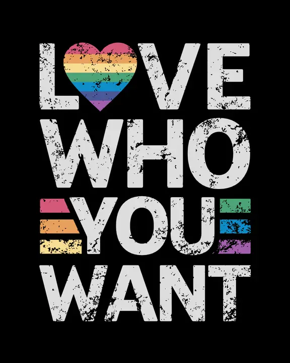 T-shirt design featuring the phrase 'Love Who You Want' in bold, slightly distressed typography with a grunge texture. Small, muted rainbow flags appear to the left and right of the word 'YOU.' The background is solid black - Kittl