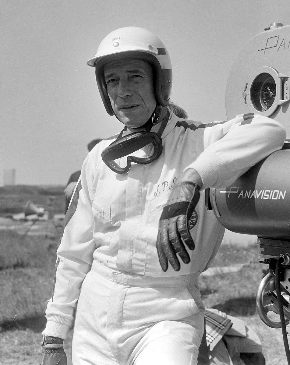 Italian-French actor Yves Montand who played fictional racing driver Jean Paul Sarti on the set of Grand Prix 1966. Public domain.