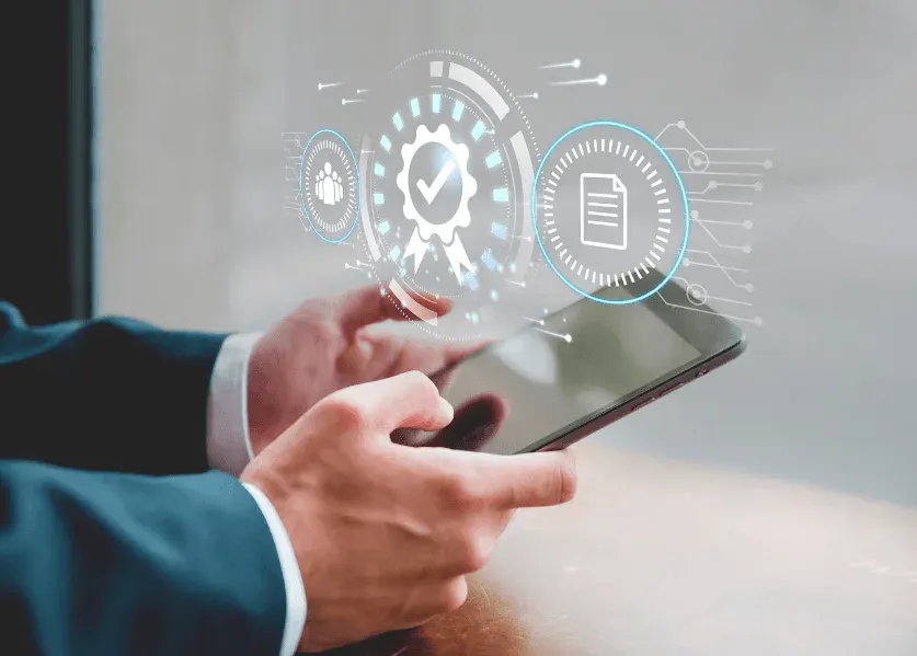 Pessoa usando smartphone em ambiente de escritório, com sobreposição de ícones e diagramas digitais de tecnologia, documentos e autenticação em estilo futurista.