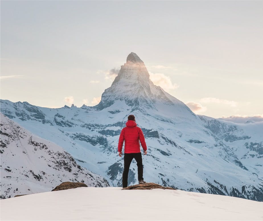 backpacker standing on a cliff