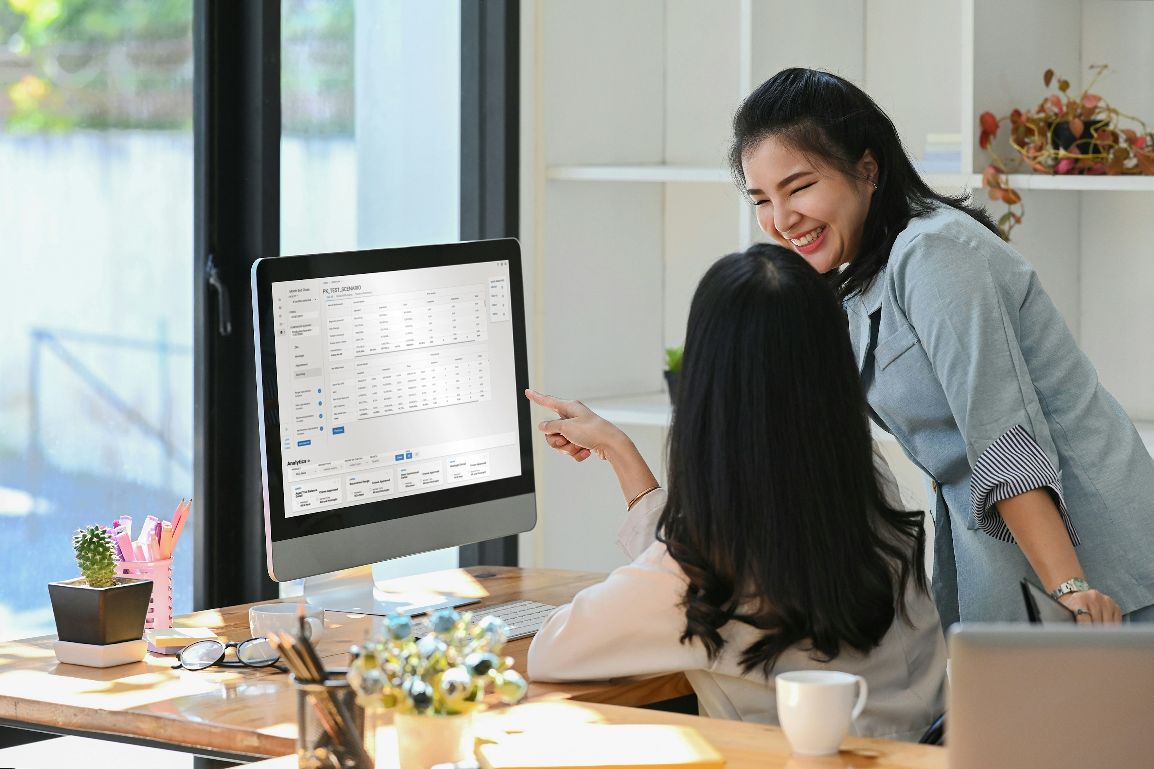 2 Women working on a computer