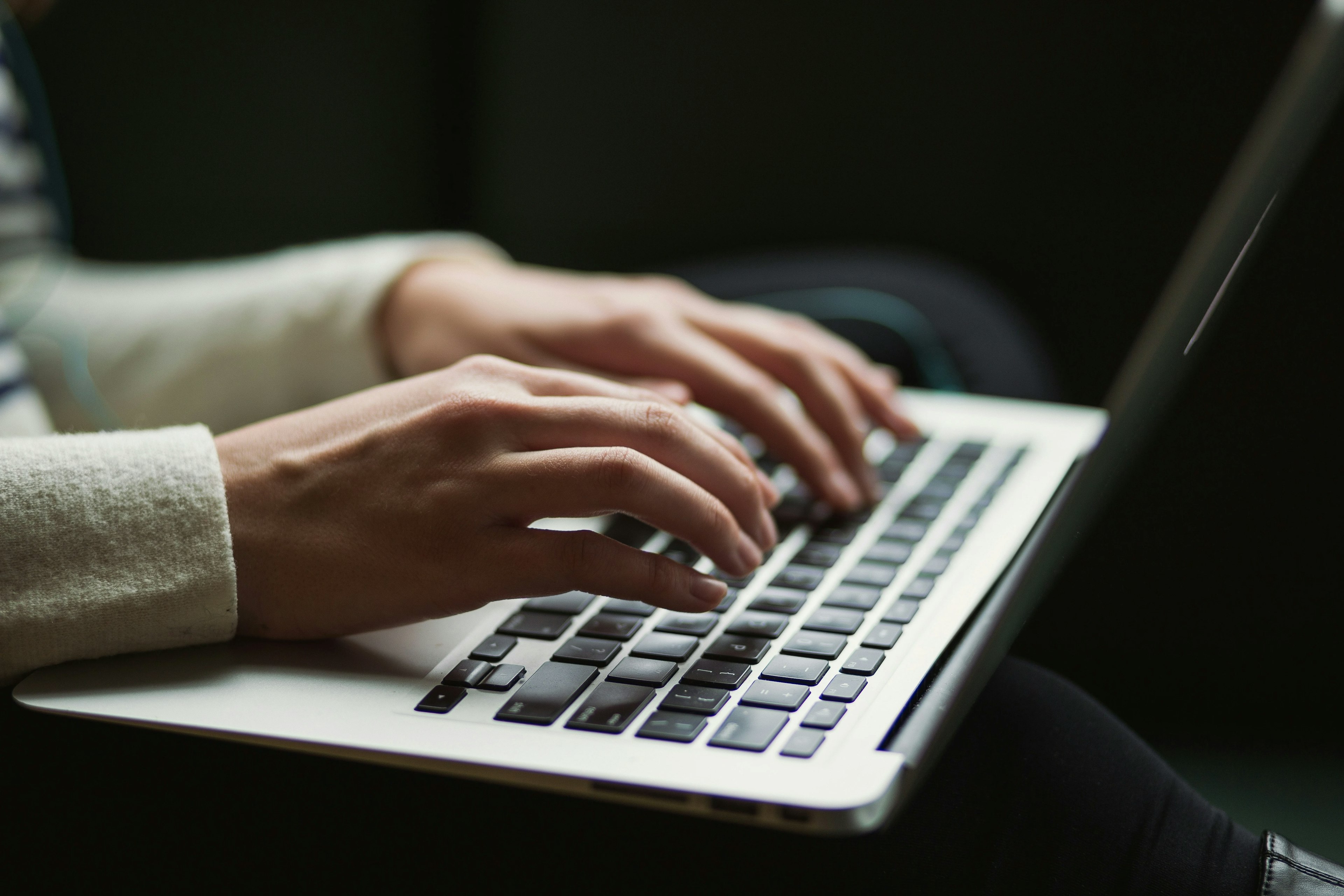 Closeup of hands on a keyboard