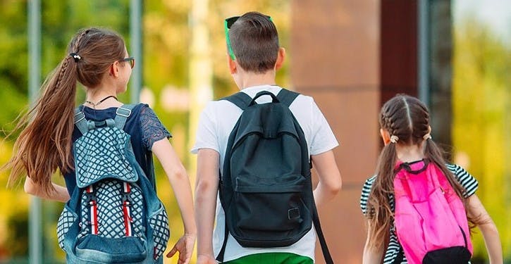 Three students with back packs