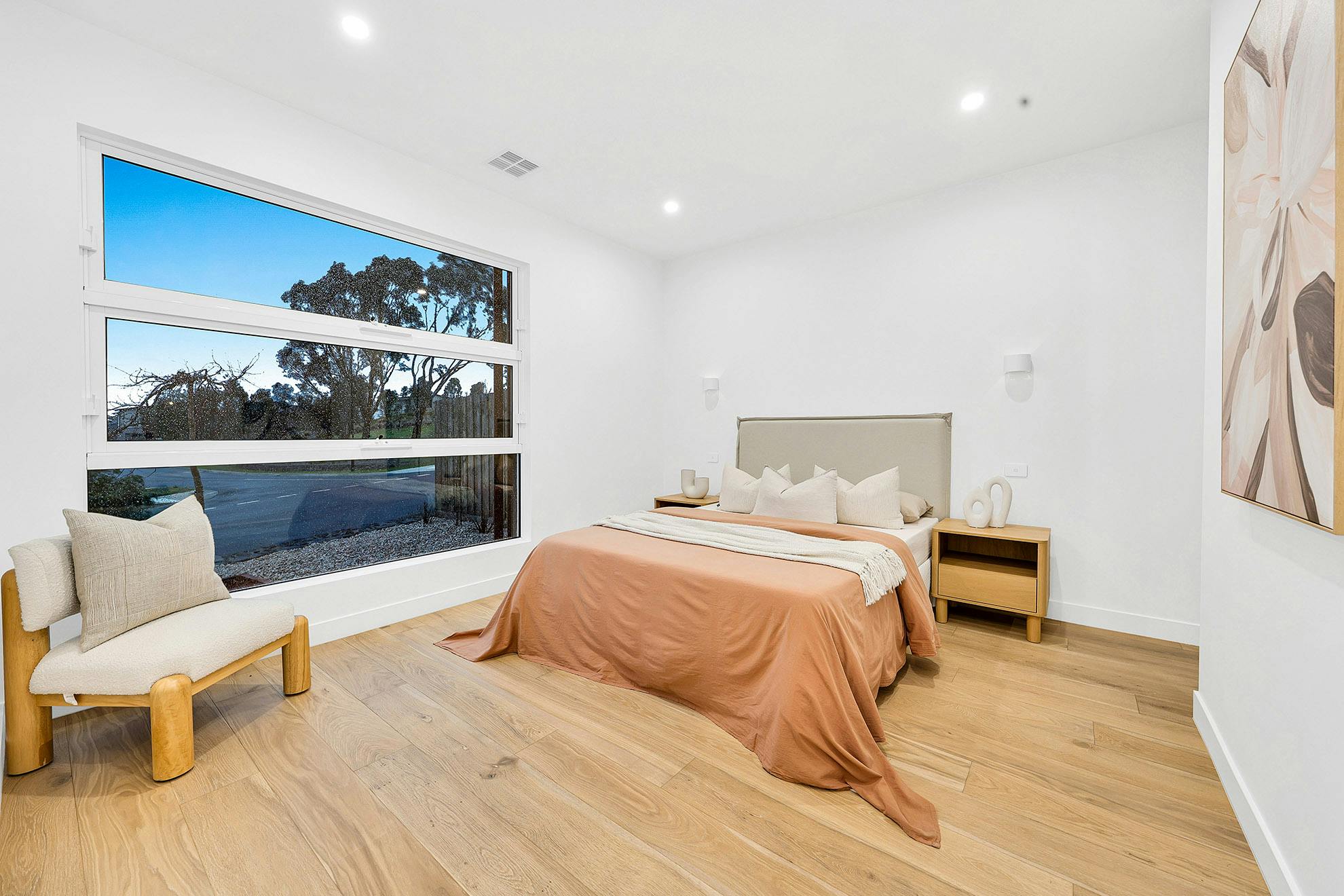 Master bedroom styled with painting