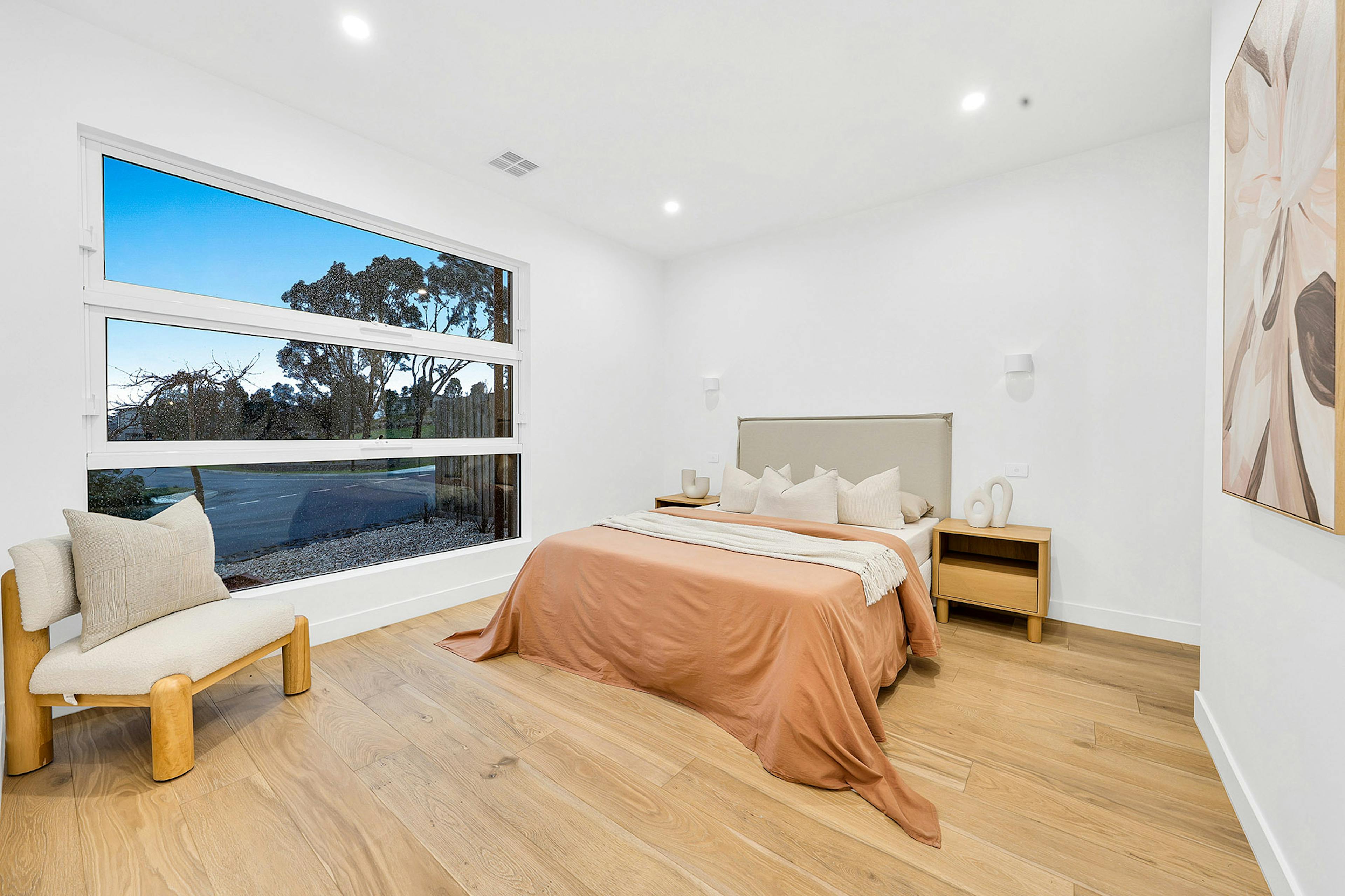Master bedroom styled with painting