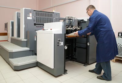 A man working in the printing manufacturing unit pic