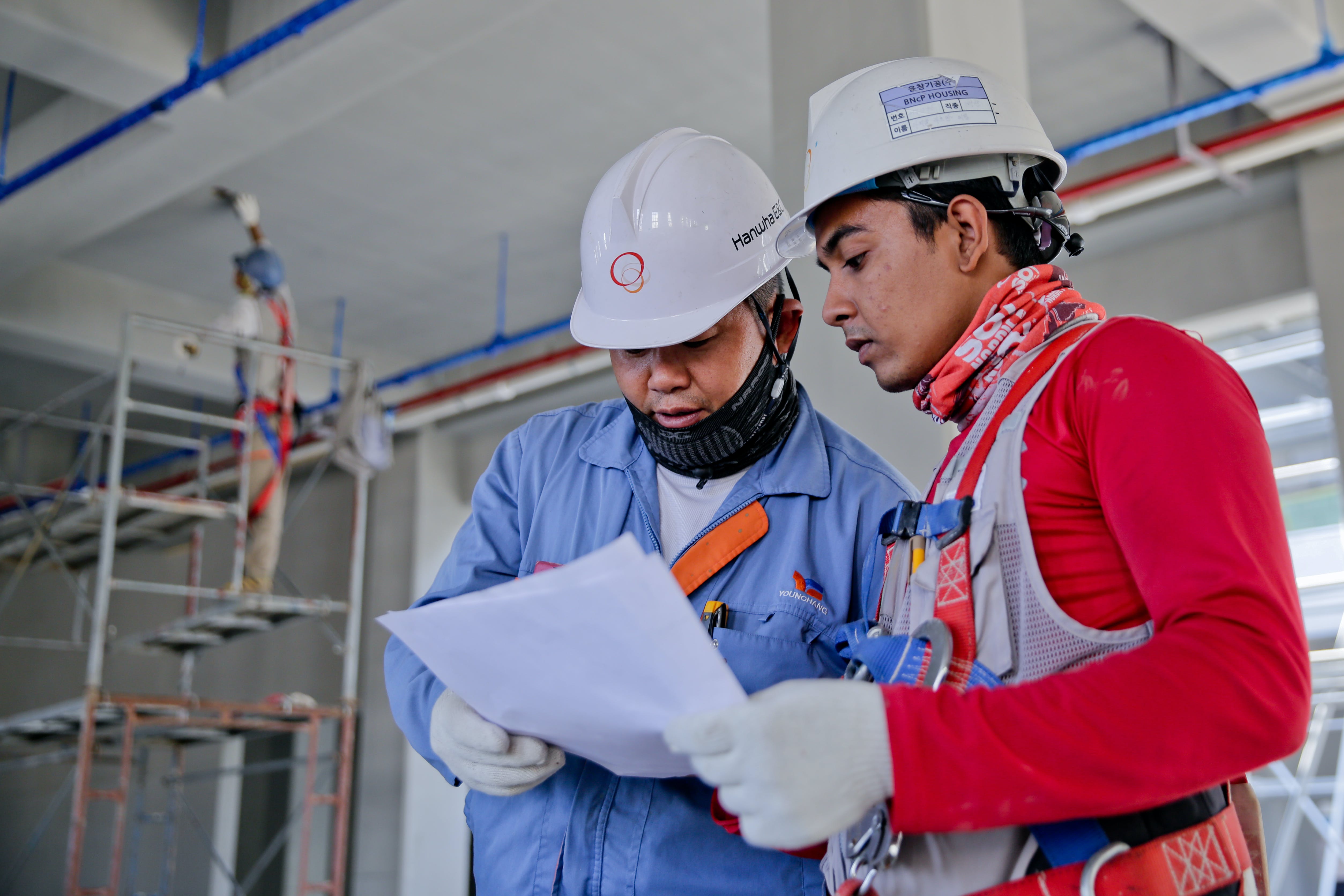 Civil engineers discussing construction project layout pic