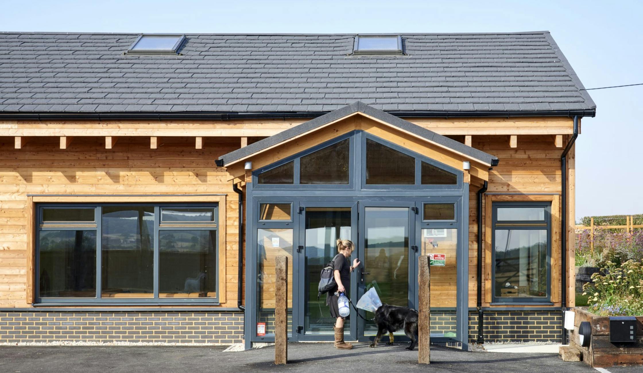 Barn-like commercial building with larch facade