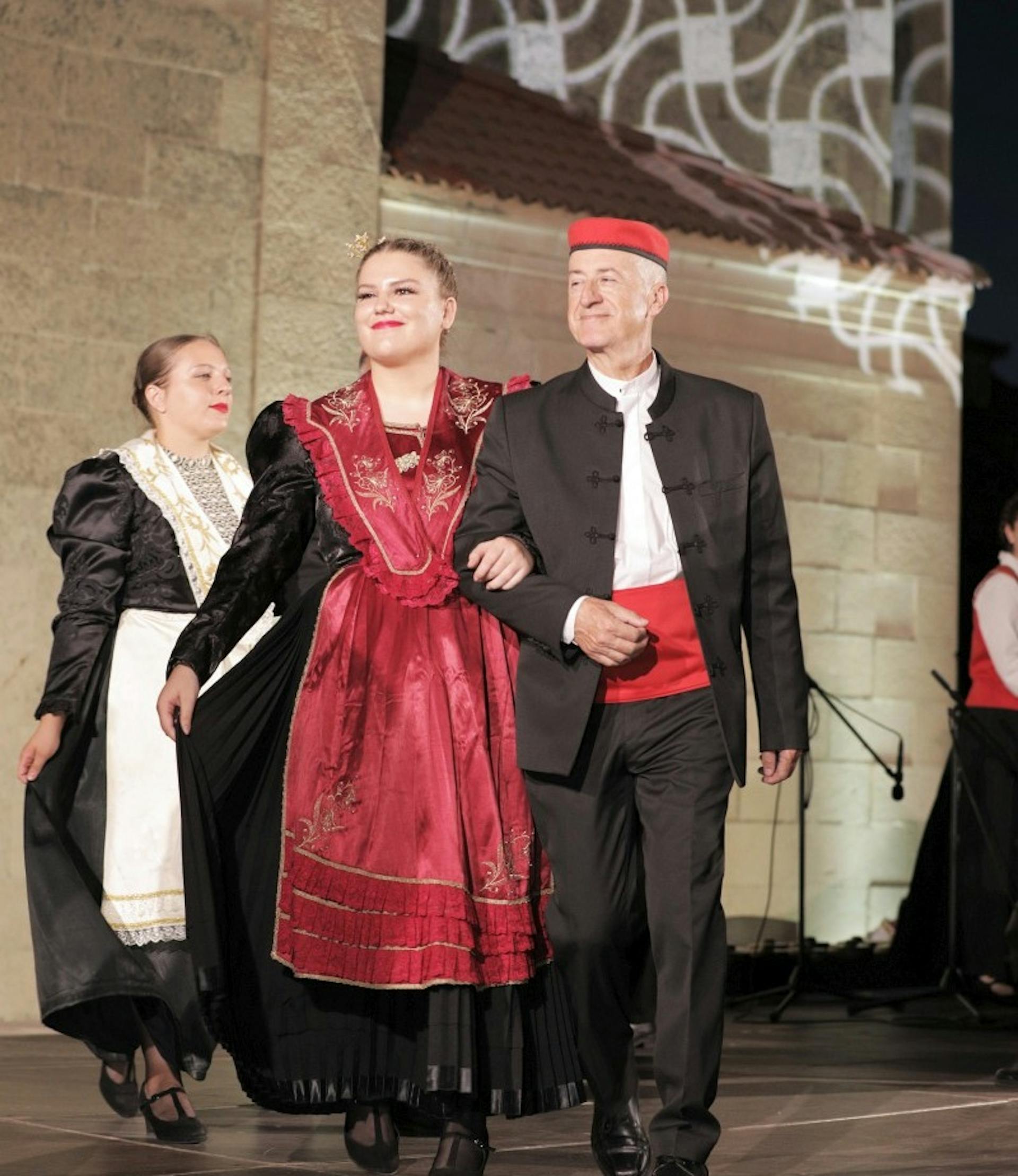 A couple in traditional dalmatian outfits

