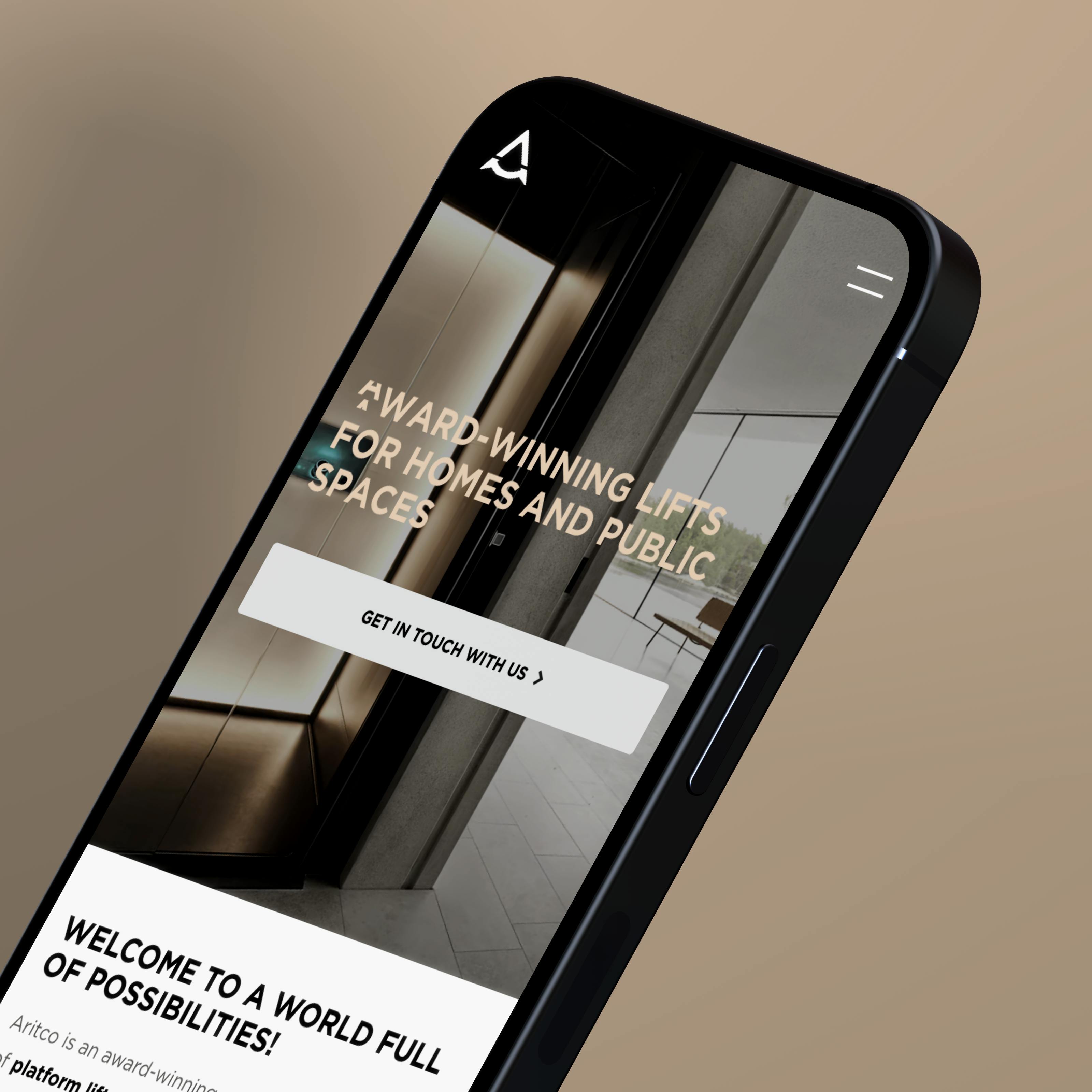 Mockup of a mobile phone with Aritco's website on the screen