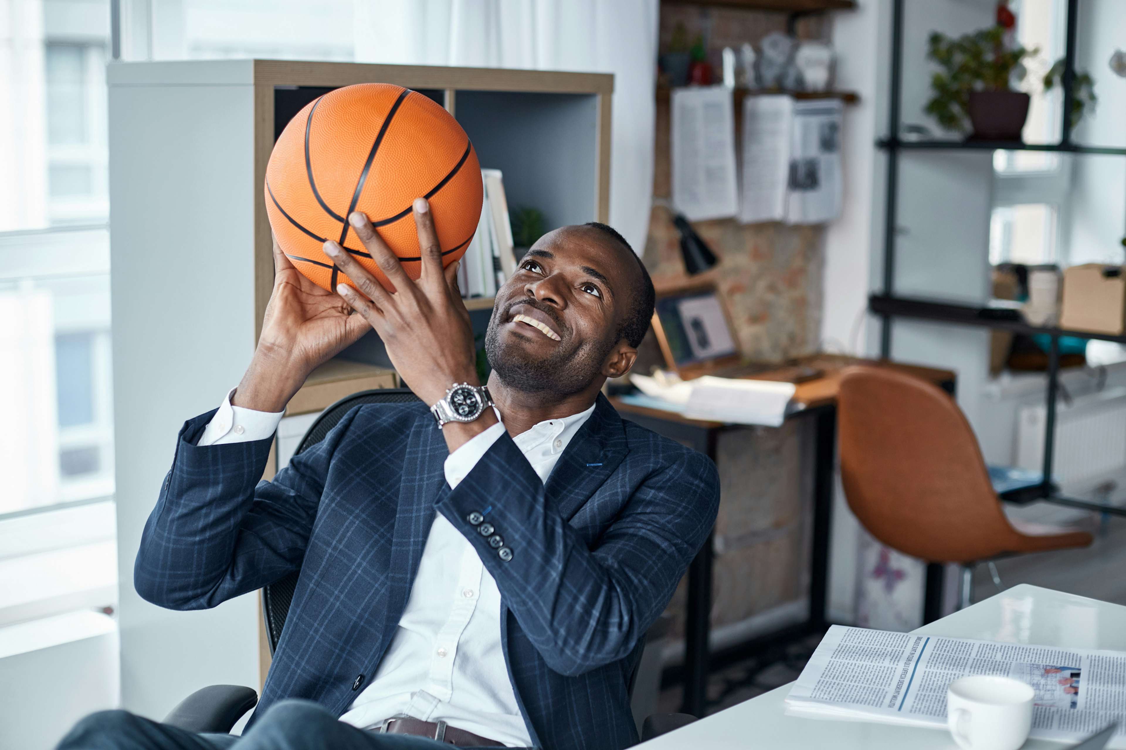 Sports business professional sitting in his office