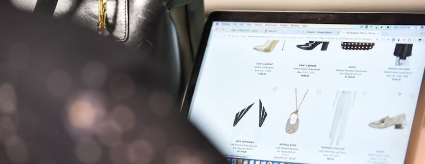 Laptop screen showing products from a luxury fashion brand
