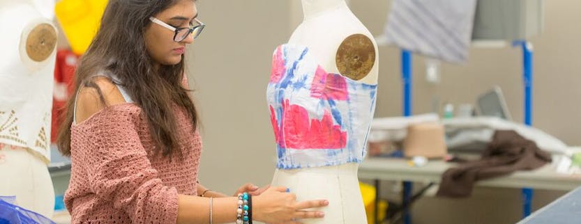 Decorative: women draping eco-friendly fabric on dress form