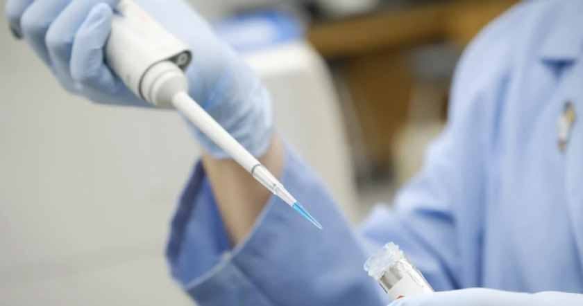 Doctor using a medical pipette 